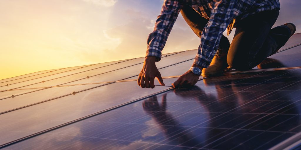 Expert solar technician Brisbane installing residential solar panels Sunshine Coast clean energy rooftop installation sunset