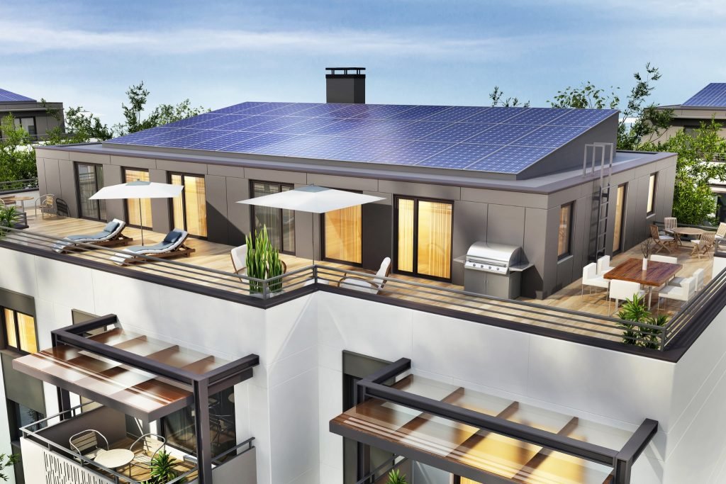 Design & Install 1 Modern rooftop flat with large windows, a spacious terrace featuring lounge chairs, parasols, a dining table, and a barbecue. The solar-covered roof is surrounded by greenery, perfect for soaking up Brisbane’s sunny lifestyle.