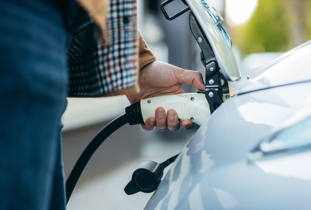 Electric vehicle being charged on the Sunshine Coast, showcasing Limitless Solar Solutions' EV charging installation services.
